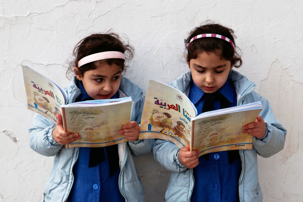 (2011_Education_for_All_Global_Monitoring_Report)_-Government_primary_school_in_Amman,_Jordan_-_Young_girls_reading