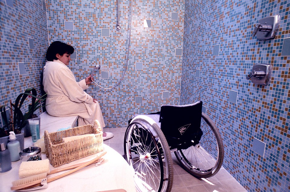 16769-a-woman-in-a-wheelchair-getting-into-a-shower-pv