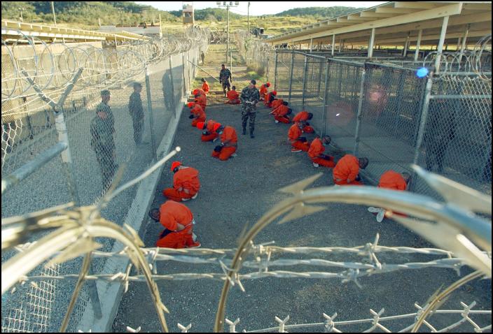 Guantanamo_captives_wait_during_processing_on_January_11th,_2002