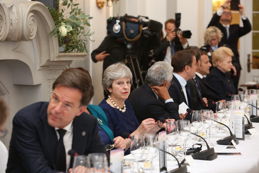 Theresa May sat at a table with other world leaders