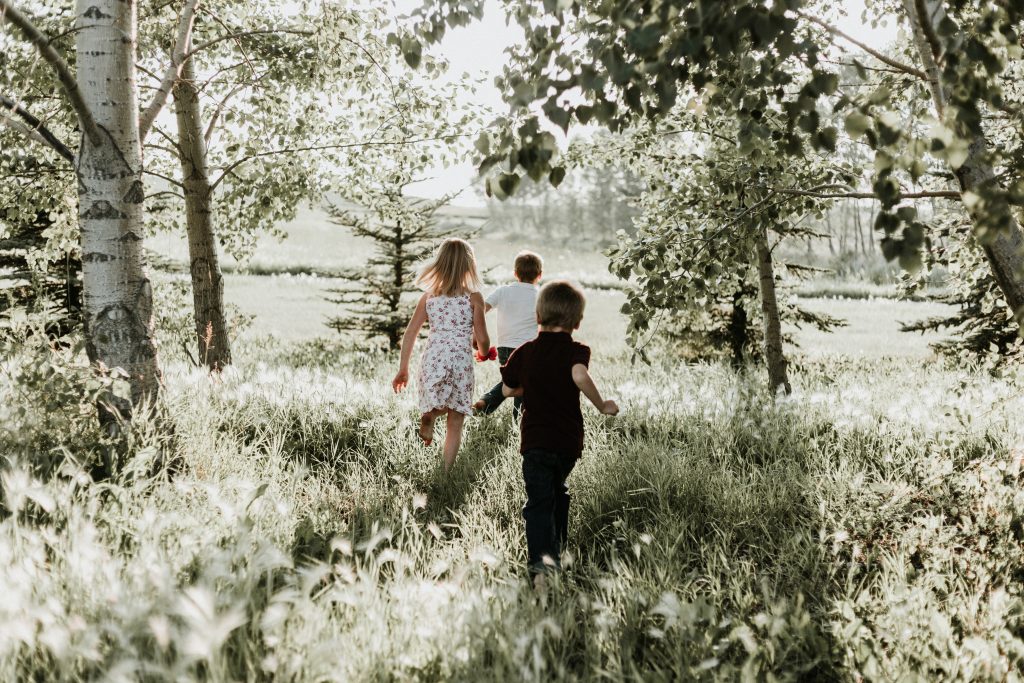 Children running in a field