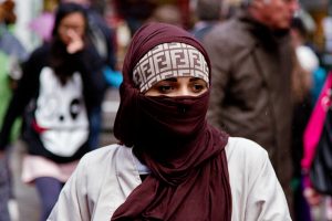 Muslim woman walks streets of London