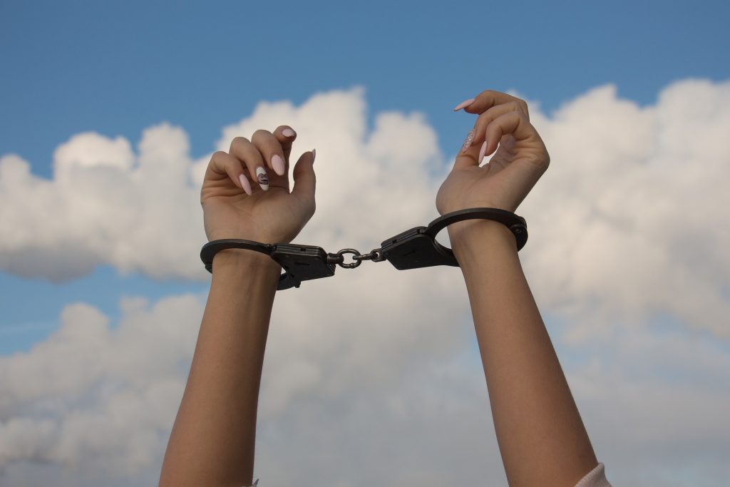 https://pixabay.com/en/hands-handcuffs-the-dependence-of-1875444/
