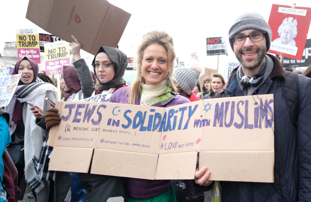People holding Muslim solidarity sign