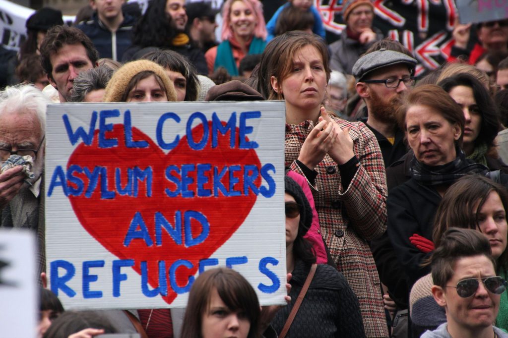 Welcome asylum seekers sign